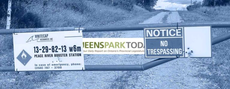 A sign with bullet holes in it says to keep out, private land