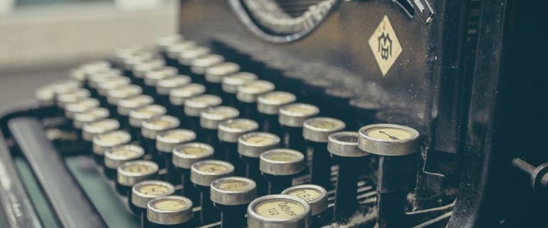 A close up of an old typewriter keyboard