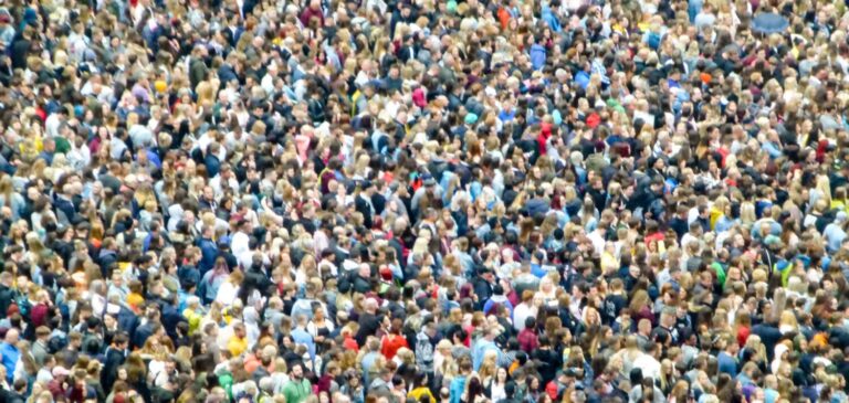A crowd of thousands of people as seen from the air.